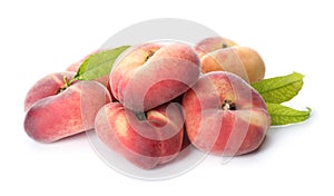 Fresh donut peaches with leaves on white background