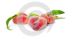 Fresh donut peaches with leaves on white background