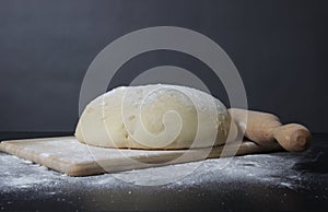 Fresh dough on a black background