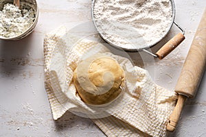 Fresh dough for making ravioli or pasta with flour.