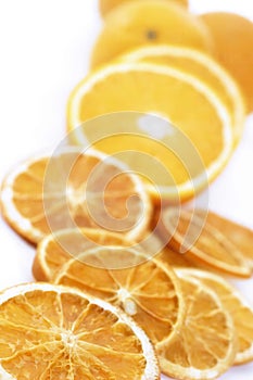 Fresh and dried orange slices, isolated on whte.