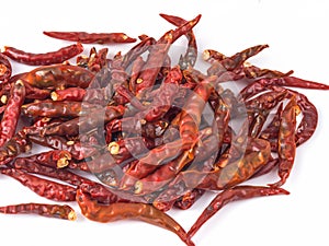 fresh and dried red hot chili peppers on a white background