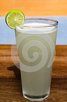 Fresh drink photo of home made limonade on wooden background photo