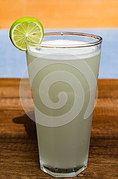 Fresh drink photo of home made limonade on wooden background