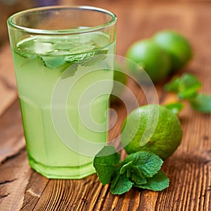 Fresh drink photo of home made limonade on wooden background