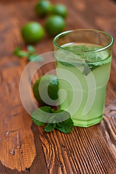 Fresh drink photo of home made limonade on wooden background