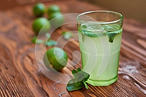 Fresh drink photo of home made limonade on wooden background
