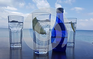 Fresh drinks against the bright blue sky and sea in Kos, Greece