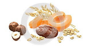 Fresh and dry apricots, dates, hazelnuts, rolled oats isolated on white background