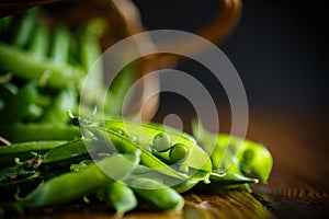 Fresh early green peas in a basket