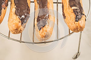 Fresh eclairs on a white table/fresh eclairs on a white teble. T