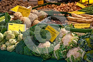 Fresh ecological vegetables for sale at farmer\'s market, cauliflowers, cabbages, onions, food stall