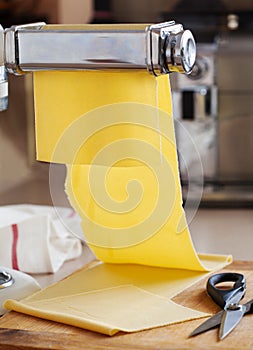 Fresh egg pasta rolled in pasta machine