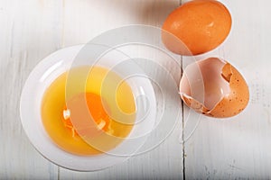 Fresh egg yolks in a porcelain bowl