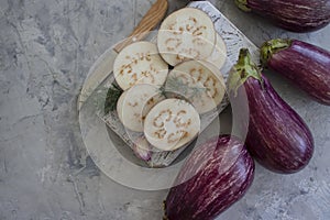 Fresh eggplant on old background rustic summer dinner organic