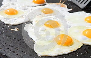 Fresh eggs being fried