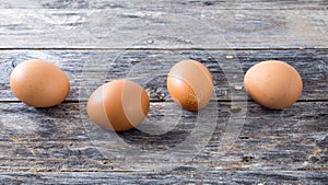 Fresh eggs from the farm are arranged in a wooden table