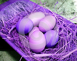 Fresh eggs laying in  hye in an old vintage antique wooden tray