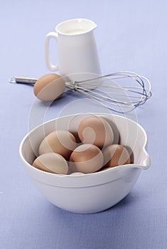 Fresh eggs in mixing bowl