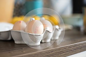 Fresh eggs in the morning: Cardbox of free range eggs in the kitchen