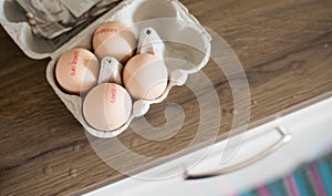 Fresh eggs in the morning: Cardbox of free range eggs in the kitchen