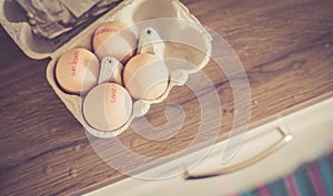 Fresh eggs in the morning: Cardbox of free range eggs in the kitchen