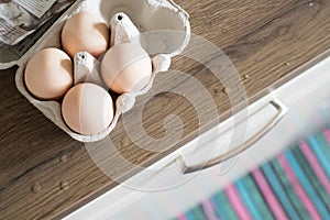 Fresh eggs in the morning: Cardbox of free range eggs in the kitchen