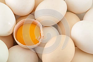 Fresh eggs with one broken