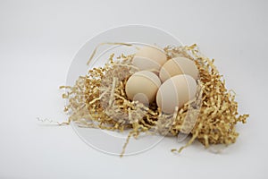 Fresh Eggs on of straw