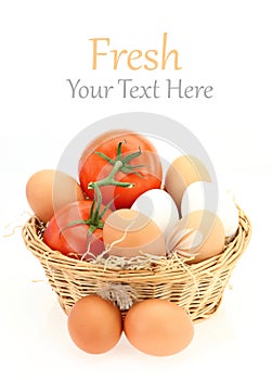 Fresh eggs and tomatoes in the basket