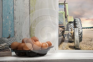 Fresh eggs on window sill, Field and tractor