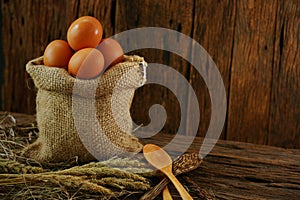 Fresh eggs on wooden background from farm and prepare for cook in kitchen room, Organic food and clean food for healthy