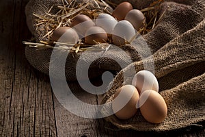 Fresh eggs on wooden dark table