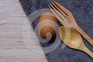 Fresh eggs on wooden and Microfiber Cloth background