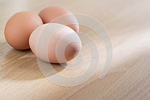 Fresh eggs on wooden table