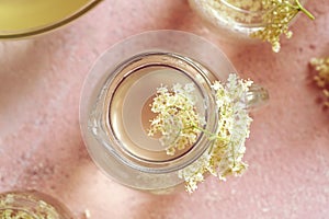 Fresh elder flowers on a jug of lemonade in spring