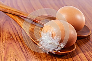 Fresh farm eggs on a wooden rustic background.