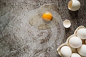 Fresh farm white chicken eggs close up, one broken, visible yolk 3