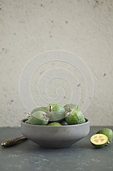 Fresh feijoa fruit in a cup.