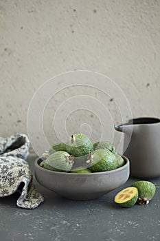 Fresh feijoa fruit in a cup.