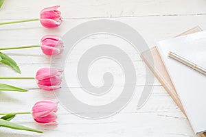 Fresh feminine workspace with tulips
