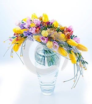 Fresh festive bouquet of flowers in glass vase