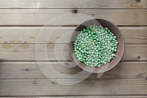 Fresh field (Vicia faba) beans in a bowl, top view