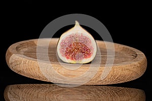 Fresh fig fruit isolated on black glass