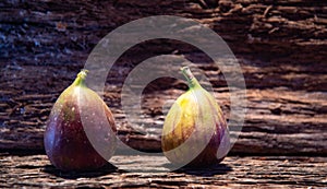 Fresh fig fruits on aged wooden background photo