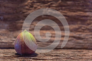 Fresh fig fruits on aged wooden background photo