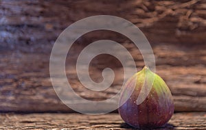 Fresh fig fruits on aged wooden background photo