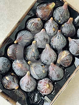 Fresh fig fruits in a box close-up