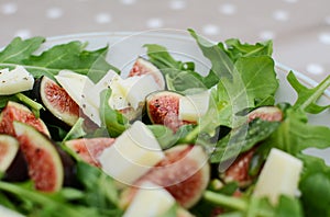 Fresh fig salad with pecorino and rocket leaves