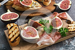 Fresh figs with ham and cheese. Appetizing snack. Selective focus